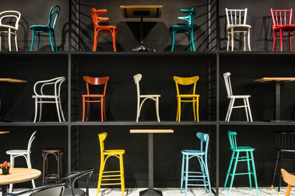 Old-fashioned wooden chairs of different colors and shapes