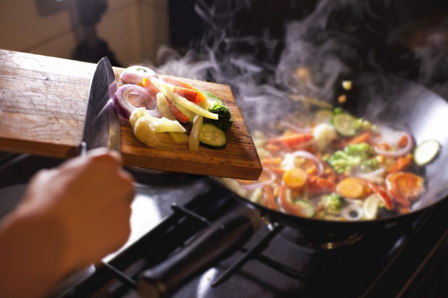 putting-chopped-vegetables-in-the-pan