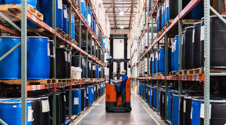 Employee in vehicle warehouse