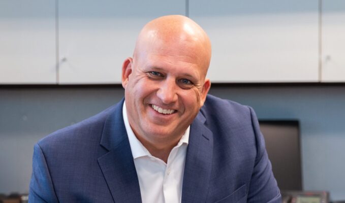 CEO Brett Finley at his desk