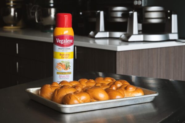 Vegalene Buttery Delite spray and tray of fresh baked rolls